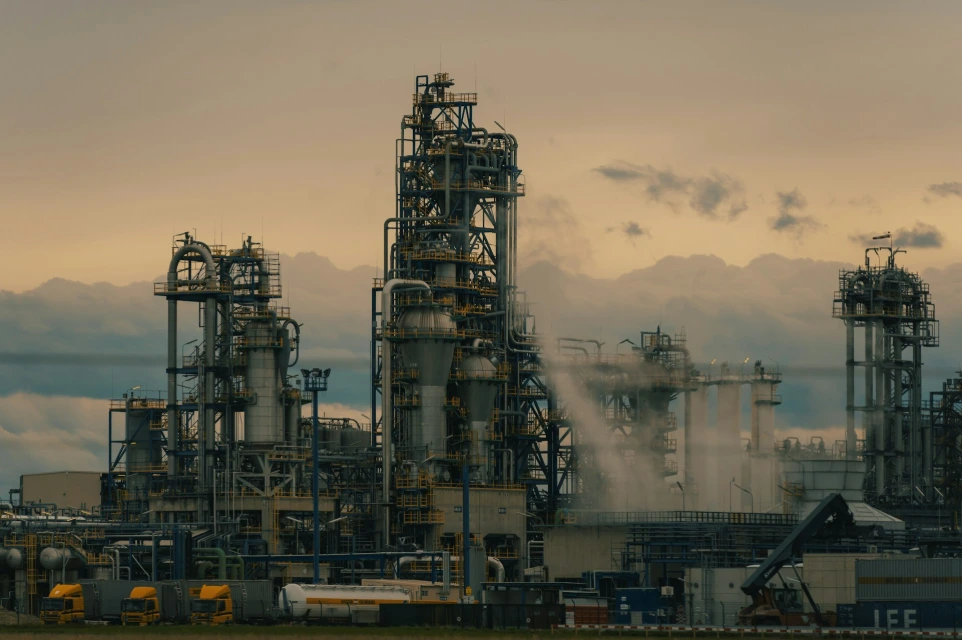 a factory with a lot of smoke coming out of it huasun